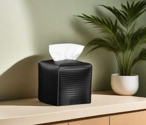 A Black Tissue Box Cover on the cabinet surface.