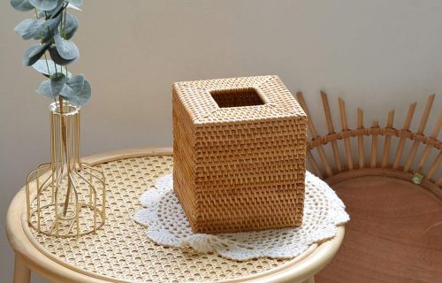 A Square Rattan Tissue Box Cover displayed on the table.